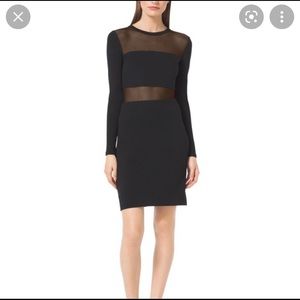 Michael Kors black dress with mesh paneling.